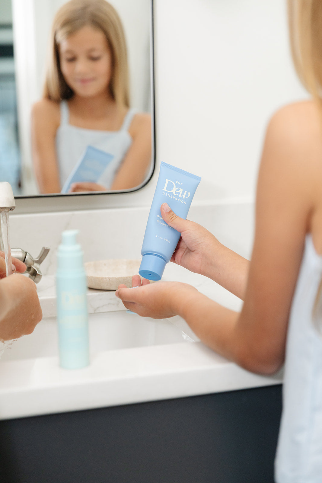 A girl using the the Dew-O Kit products